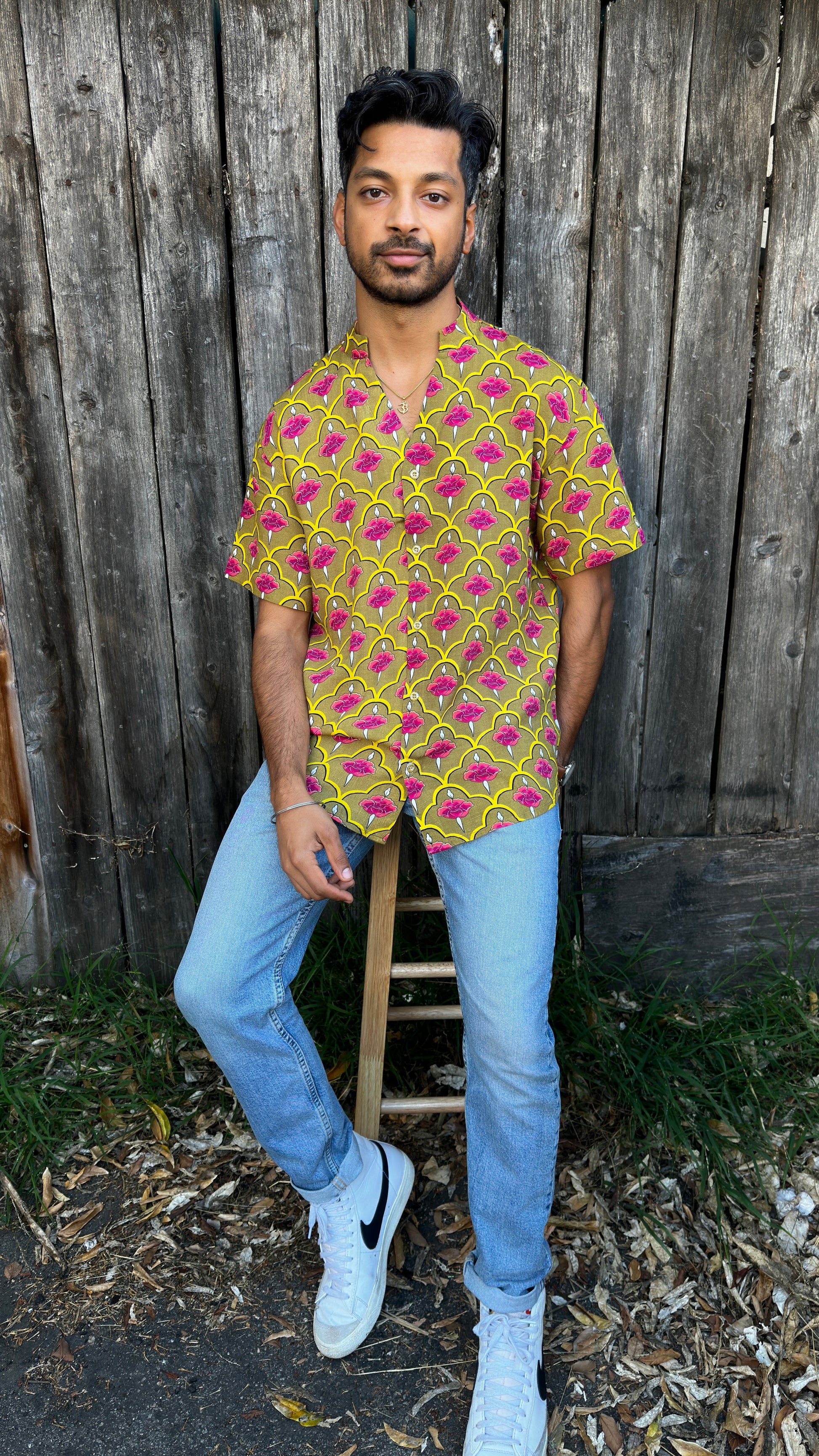 Inspired by the cool, easy Cuban Collar shirt. The Ranjha grounds itself in its South Asian roots with the Band Collar neck paired alongside a V-cut in the middle to maintain the Cuban Collar swag. Full button men's shirt. Red Rose print. A shirt designed to be a South Asian  inspired elevated casual rayon shirt. Gulab | Band Collar Men's Shirts Short sleeve | Rose Print V-Cut Rayon