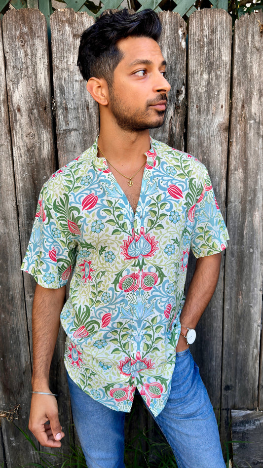 Inspired by the cool, easy Cuban Collar shirt. The Ranjha grounds itself in its South Asian roots with the Band Collar neck paired alongside a V-cut in the middle to maintain the Cuban Collar swag. Full button men's shirt. Floral print. A shirt designed to be a South Asian inspired elevated casual rayon shirt. Taj | Band Collar Men's Shirts | Short Sleeve Floral Print V-Cut Rayon
